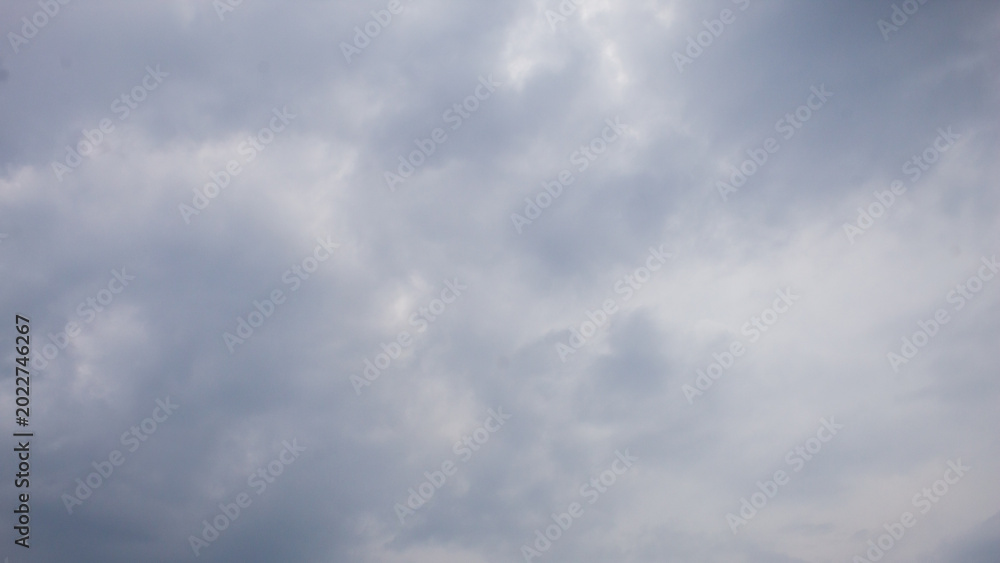 Fototapeta premium The background view of the sky is dominated by thick and dark clouds, which is often associated with cloudy weather or about to rain.