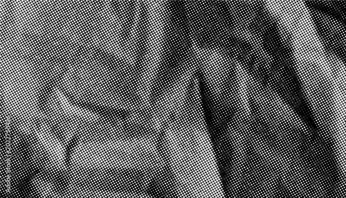 Foto Halftone crumpled paper texture with white dotted, rough and wrinkled surface