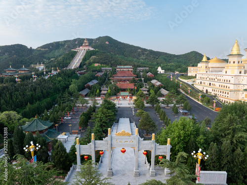 Tableau sur toile Aerial view of the Nanshan Great Buddha scenic area in Shandong with temples, pa