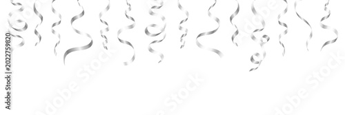 Konstfotografi Silver hanging curling ribbons and party streamers border isolated on white