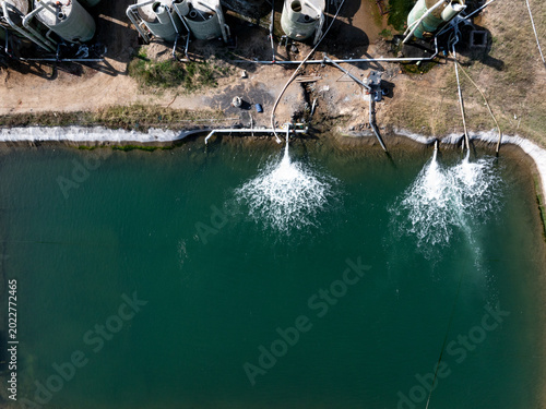 Φωτογραφία Aerial view of aquaculture farm aeration ponds with oxygenation systems in opera
