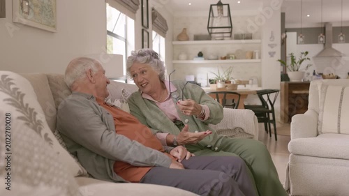 Retired couple talking together with joy