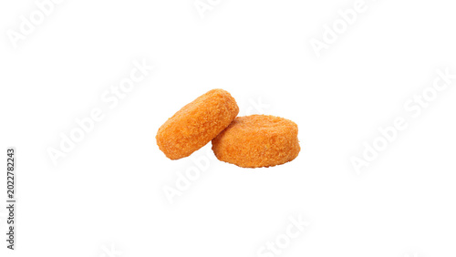 Bild auf Leinwand Two breaded golden chicken nuggets isolated on white background, crispy fried cr