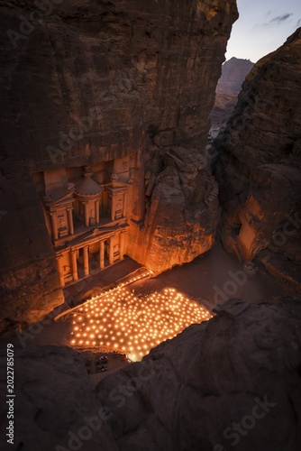 Candles in front of the Pharaoh's treasure house, struck in rock, at night, view from above into the gorge, facade of the treasure house Al-Khazneh, Khazne Faraun, mausoleum in the Nabataean city of Petra, near Wadi Musa, Jordan