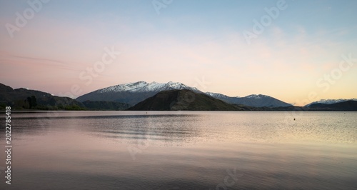 Sunrise, morning mood, Wanaka Lake and snow covered mountains, Glendhu Bay, Otago, South Island