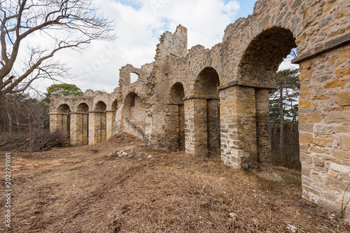 Fényképezés Romantic stone arcade folly ruin with arches in winter forest at Moedling Hauerh