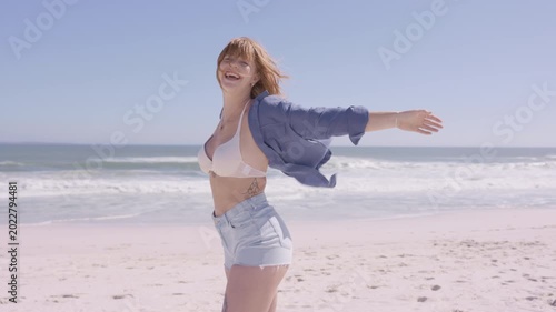 Beautiful woman enjoying sun at tropical beach