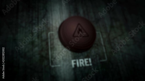 Fire alert symbol light flashing on metal panel macro view. Flame danger warning lamp sign on industrial dashboard abstract icon technology concept.