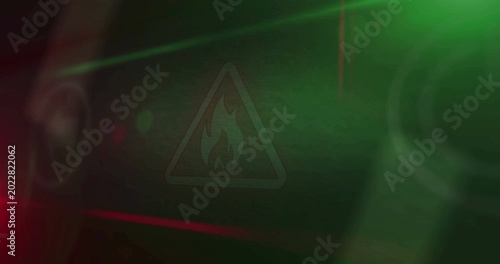 Fire alert symbol light flashing on display macro view. Flame danger warning icon on car dashboard control screen. Loopable and seamless abstract technology concept.
