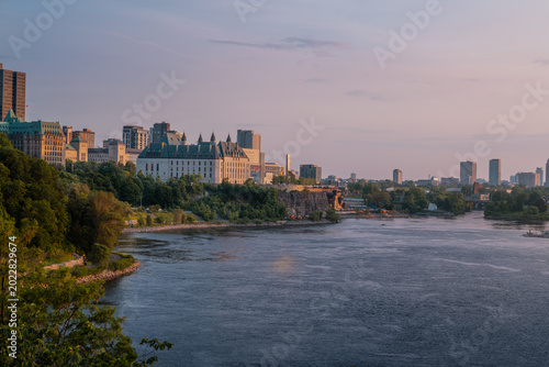 Ottawa River skyline at sunset with the Supreme Court of Canada - Ottawa, Ontario, Canada
