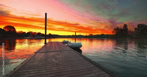 Fantastic sunrise over the Angera pier on lake Maggiore in Italy.