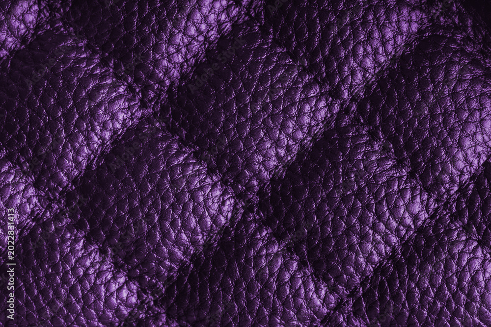 Obraz premium Close up, macro of purple quilted leather texture with stitched diamond pattern, luxury material surface shining metal effect for fashion, upholstery or design wallpaper, rough, relief background