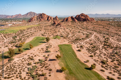 Fotografie Aerial view of Scottsdale, Arizona landscape with a golf course winding through