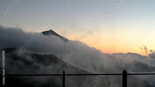 Teide volcano peak at sunset above moving cloud inversion in Tenerife