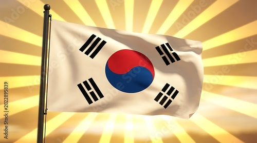 The South Korean flag waves proudly in the wind against a vibrant sunny background with rays.