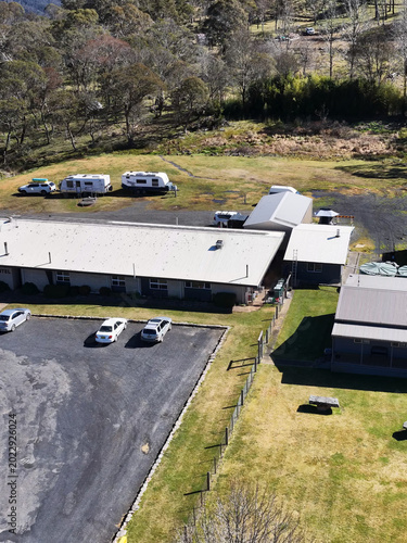 Canvas-taulu Aerial View of Rural Australian Motel with Parking Lot and Caravans