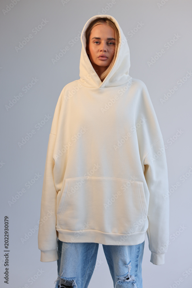 Fototapeta premium Oversized Hoodie Mockup On Female Model Blank Beige Hooded Sweatshirt Streetwear Style