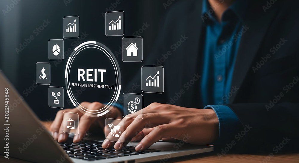 Naklejka premium Businessman using laptop with REIT Real Estate Investment Trust virtual interface