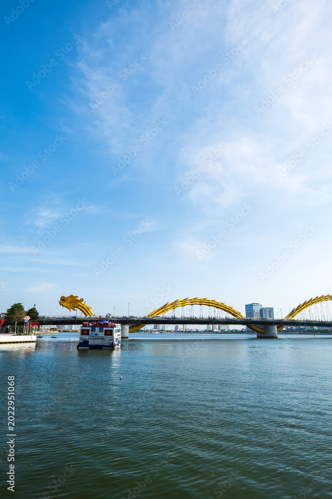 Fototapeta premium Dragon bridge over Han river in Danang, Vietnam. A famous landmark in Da Nang.