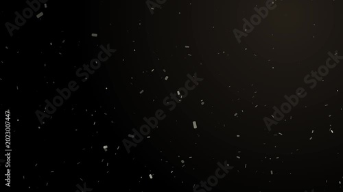 Abstract light beam illuminates gently floating dust particles on a dark background motion