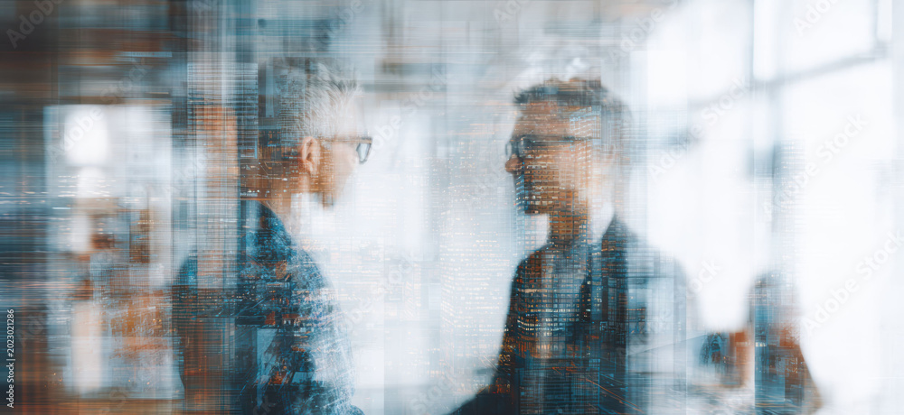 Fototapeta premium Business professionals stand behind reflective office glass during corporate meeting with teamwork, leadership, modern workplace collaboration visible throughout scene.