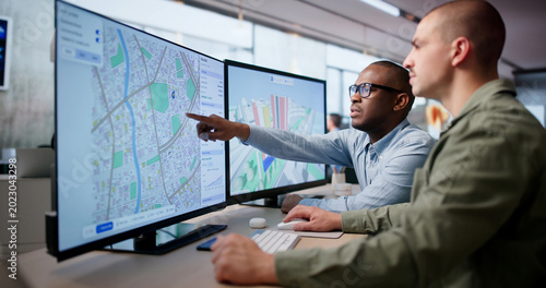 Two Urban Planners Use Computer Software