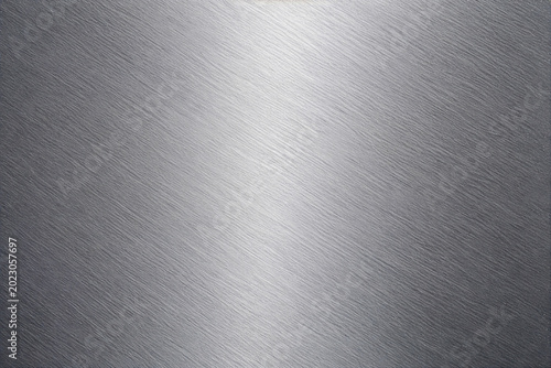 Realistic brushed metal texture with polished stainless steel finish. Industrial silver metallic background featuring fine hairline scratches, smooth reflections, and premium steel surface details.