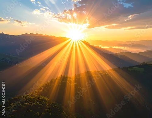 Sunrise over mountains with bright rays.
