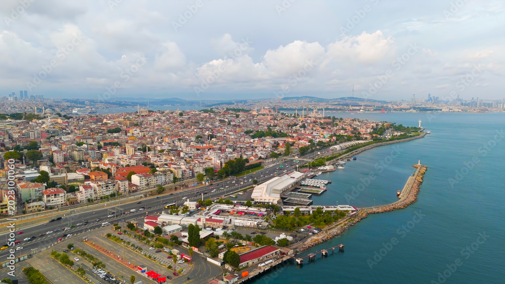 Fototapeta premium Istanbul, Turkey. Bosphorus embankment. Historical city center. Fatih district. Cloudy weather at sunset, Aerial View