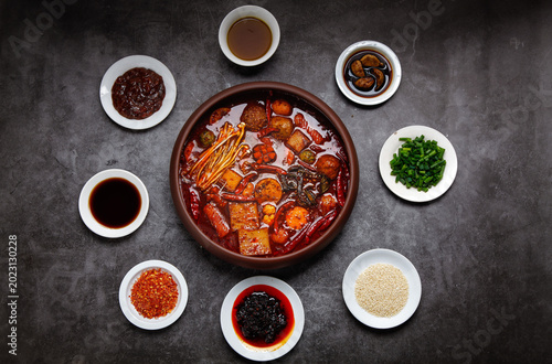 Spicy Sichuan Hot Pot with Sauces and Garnishes
