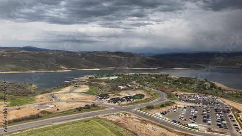 Aerial of Jordanelle Reservoir homes and parking lot in Heber Valley Utah in spring