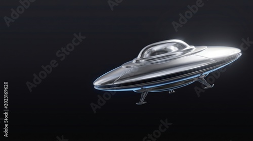 Shiny Chrome UFO Flying Saucer Model Against a Dark Background.