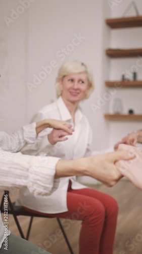 Women community, old ladies holding hands and supporting each other, psychology. Mature women communicating and meditating, good mood and positive emotions, be together, help friends, smiling people