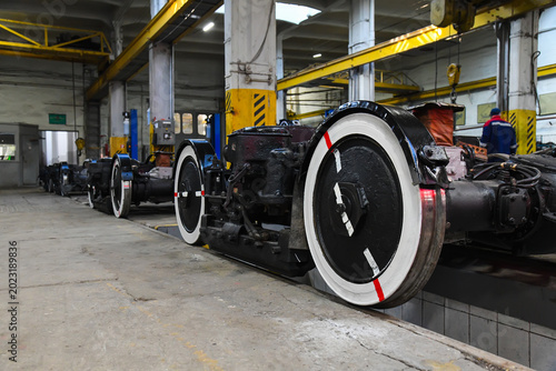 Konstfotografi Tram wheel set in a repair workshop.