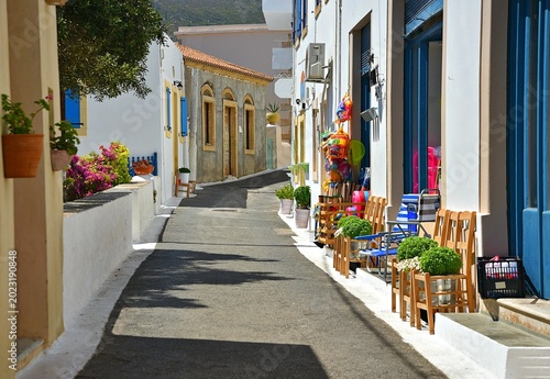 Foto Picturesque landscape with colorful traditional local shops and houses in the traditional settlement of Chora, the capital of Kythira island, Attica Greece