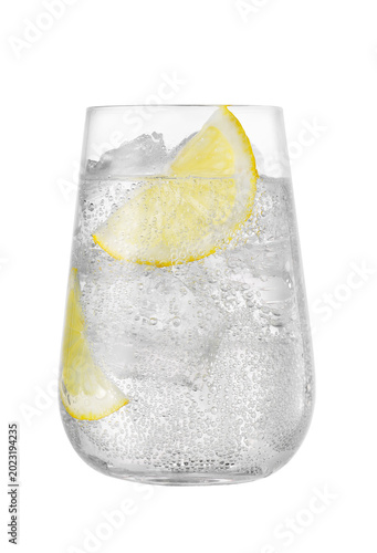 Glass of sparkling water with lemon and ice isolated on white background