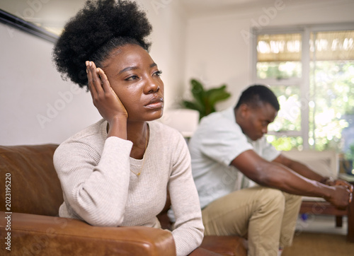 Fotografie Frustrated, black couple and argument with fight in home for conflict, breakup or disagreement