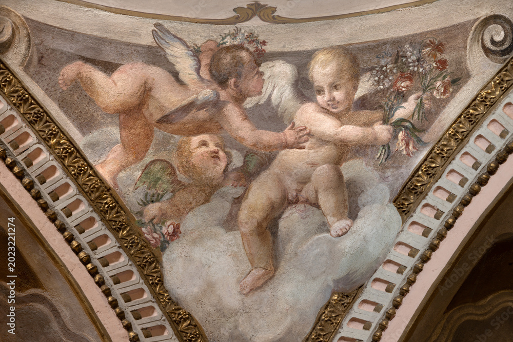 Fototapeta premium CREMA, ITALY - MARCH 20, 2026: The fresco of angels with the flowers the church Santuario di Santa Maria della Croce by Giacomo Parravicino - il Gianolo (1702).