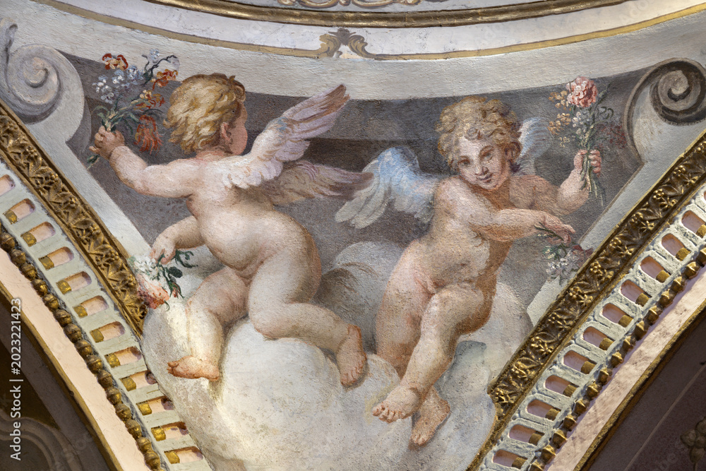 Fototapeta premium CREMA, ITALY - MARCH 20, 2026: The fresco of angels with the flowers the church Santuario di Santa Maria della Croce by Giacomo Parravicino - il Gianolo (1702).