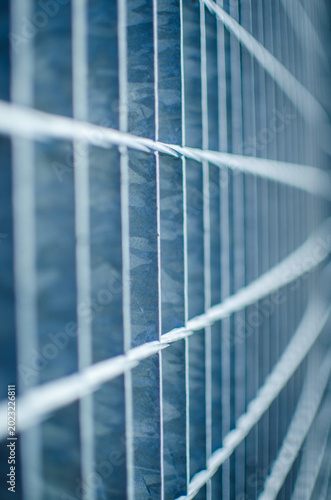 Abstract lines of industrial metal fence