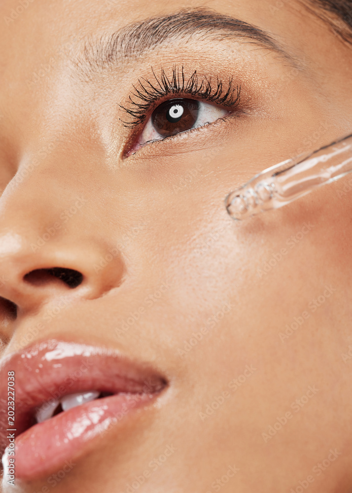 Fototapeta premium Woman, skincare or serum with dropper, retinol or hydration for skin cleanse or vitamin C. Female person, makeup and facial with pipette, liquid or anti aging treatment for beauty, collagen or detox