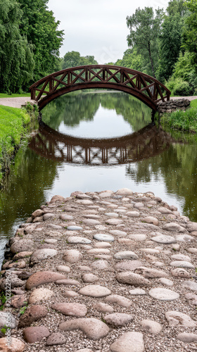 Stone path wooden bridge river reflection park green tree calm water nature scene