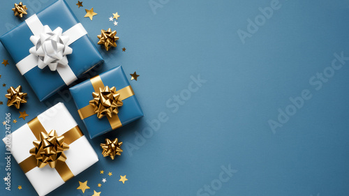 Elegant blue and white gift boxes featuring shiny gold ribbons and bows arranged neatly on a festive surface to celebrate a special holiday event today