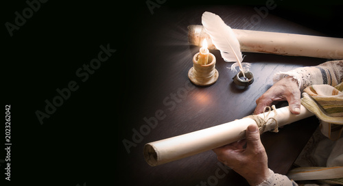 Man holding an old scroll