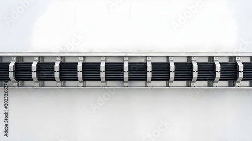Industrial ventilation system on a white wall