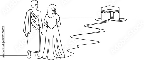 Foto Continuous line drawing of a Muslim couple performing Hajj pilgrimage towards the Kaaba