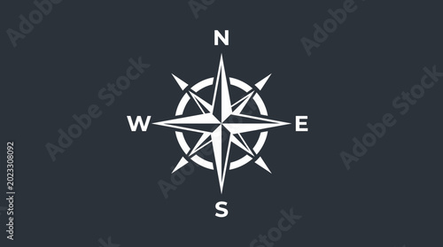 Bild auf Leinwand A white compass rose on a dark background.