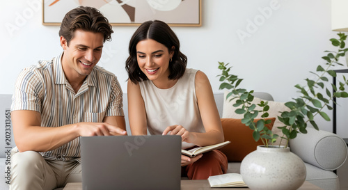 Couple planning household budget before buying a home, comparing loan paperwork, saving targets and family finance choices together during an online consultation in a relaxed apartment setting