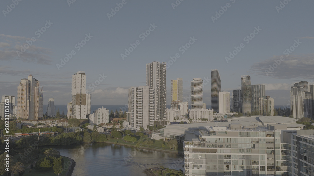 Fototapeta premium Aerial View of Gold Coast Skyscrapers and Waterway at Sunset
