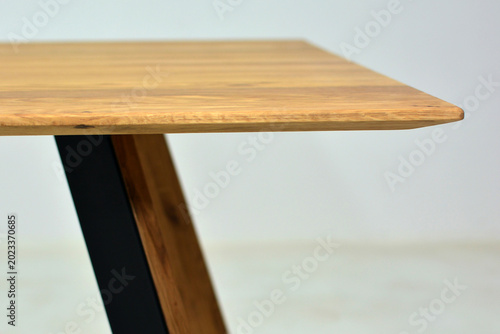 Wooden tabletop with minimalist metal leg
